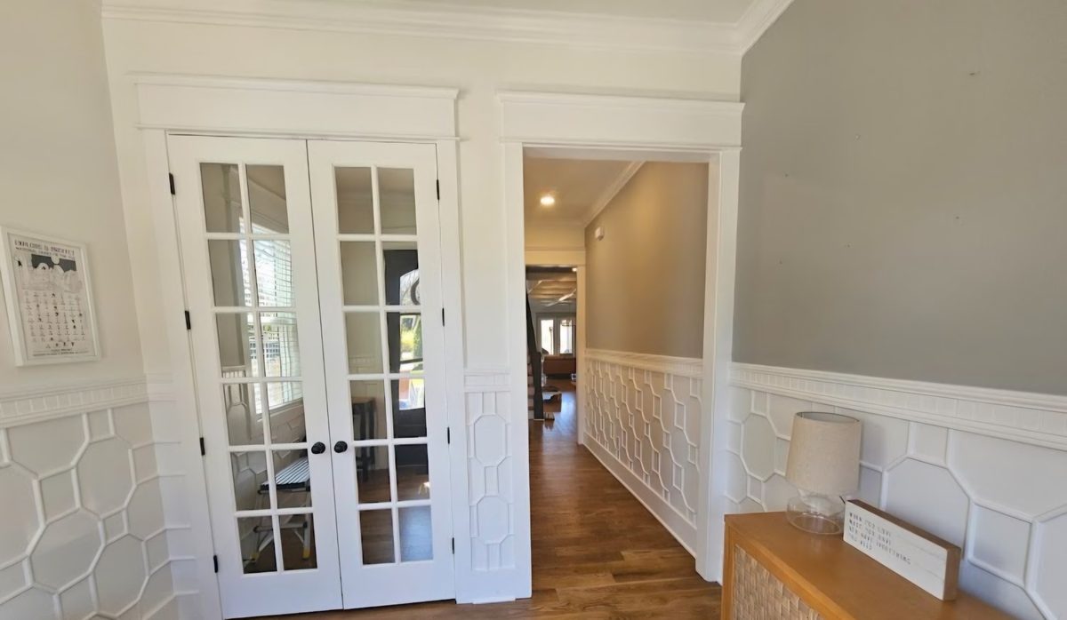Detailed white trim around French doors