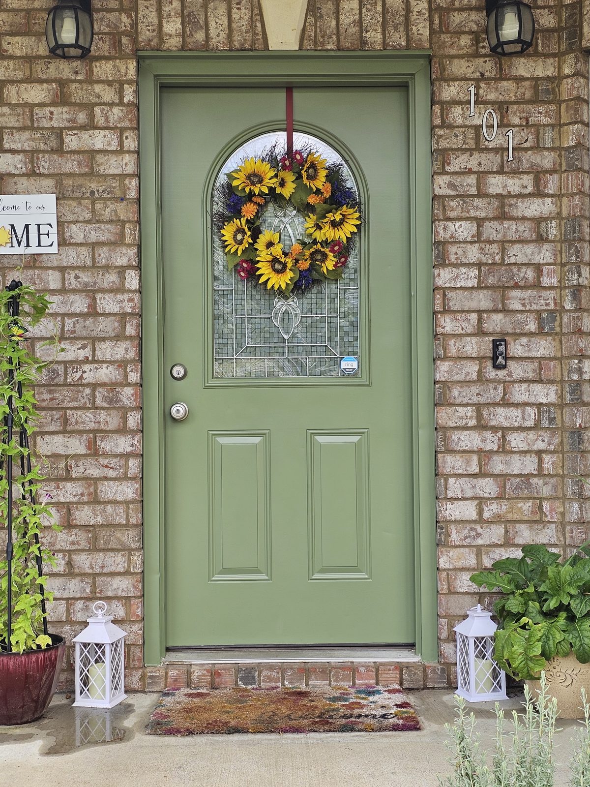 Stained front door on a brick home