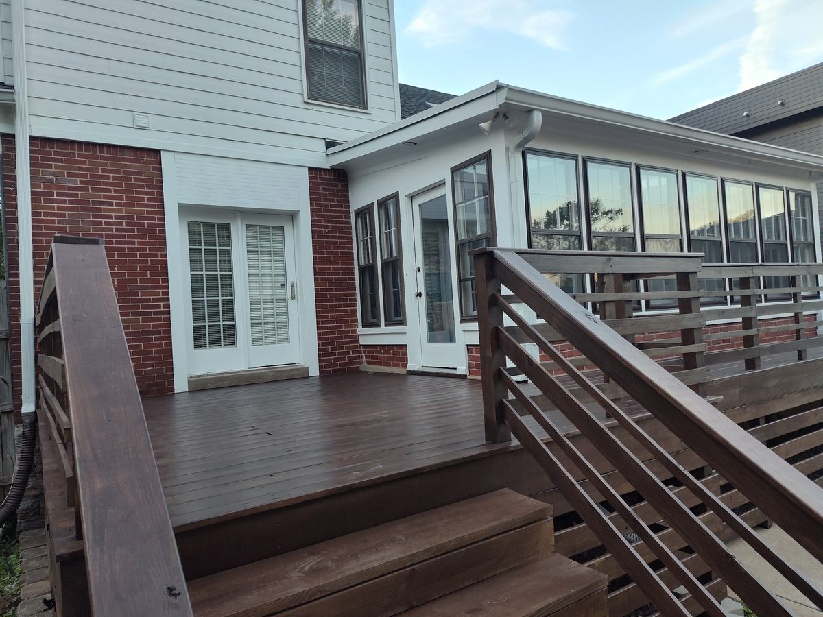 Natural-finish wood deck with modern railing