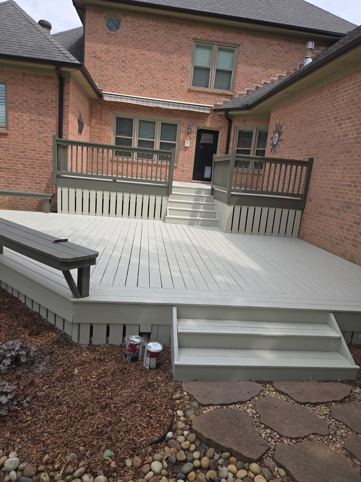 Multi-level wood deck with dark railing